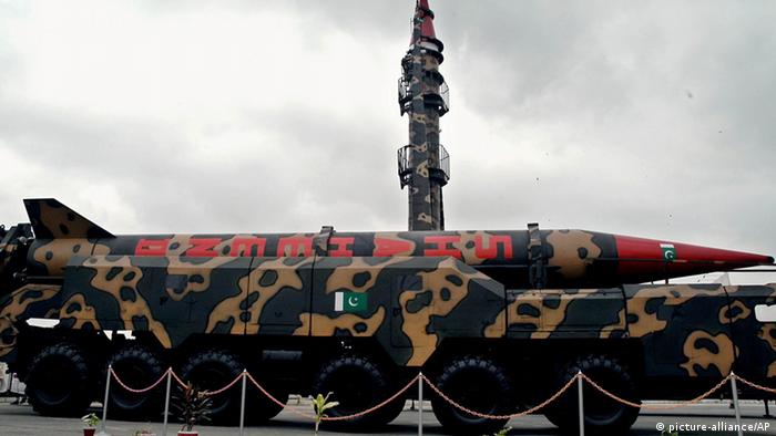 A Pakistan-made Shaheen missile capable of carrying nuclear heads, front, is displayed at a defense exhibition on Tuesday, September 14, 2004 in Karachi, Pakistan
(AP Photo/Mohammad Ali)