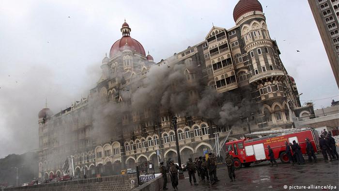 Firefighters trying to douse the fire as smoke rises from the Taj hotel building in Mumbai, India during the terrorists attack
(Photo: EPA/HARISH TYAGI)