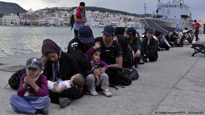 Afghan refugees at harbor on Lesbos LOUISA GOULIAMAKI/AFP/Getty Images