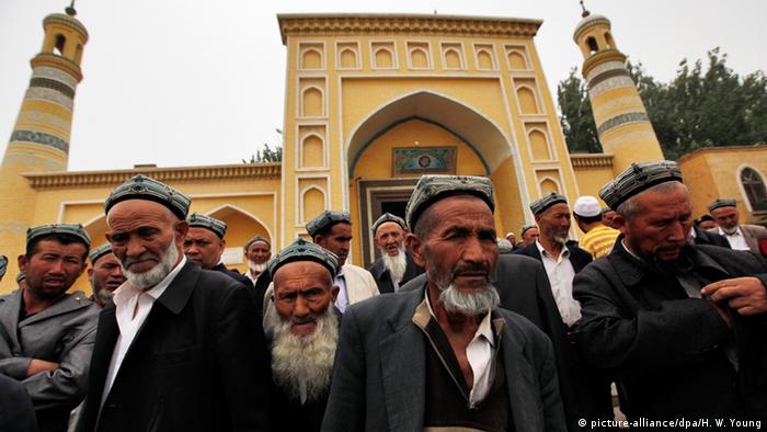 Muslim men of the Uighur ethnic group leaving the Id Kah Mosque after Friday prayers in Kashgar, Xinjiang Uighur Autonomous Region, China
(Photo: EPA/HOW HWEE YOUNG)