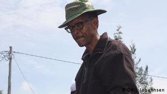 President Kagame wearing a hat and looking pensive