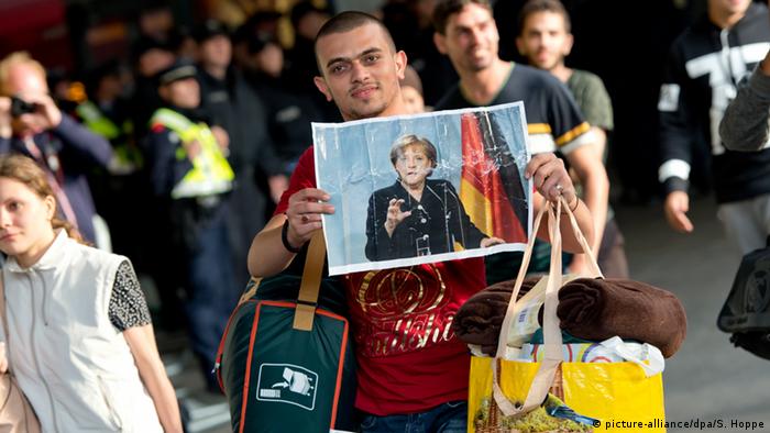 Flüchtlinge Deutschland Plakat Angela Merkel Bayern München Bahnhof 