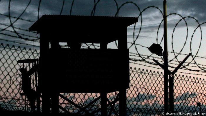 The silhouette of a watch tower at Camp Delta at Guantanamo Bay