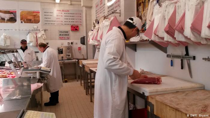 A butcher at work at Boucherie de L'Argonne in Paris