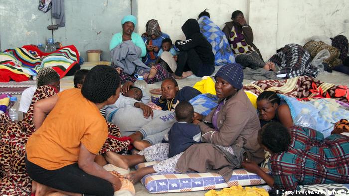 A group of illegal African migrants sitting in a shelter in Libya Copyright: Getty Images/AFP/M. Turkia