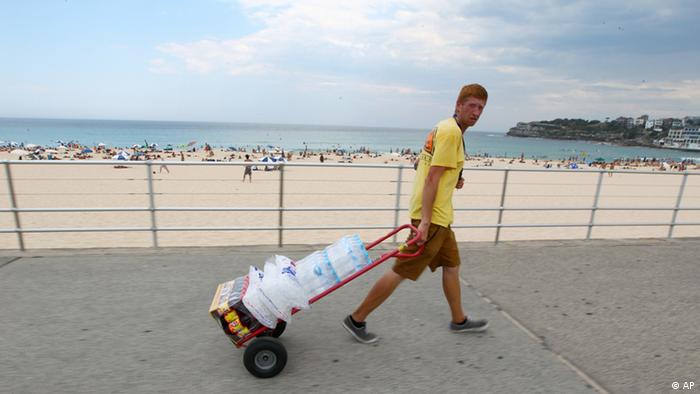 Stocking up on water to keep dehydration at bay during the deadly heat. Photo credit: AP.