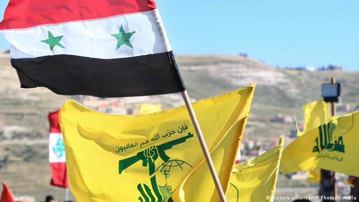Syrien Flaggen Symbolbild Waffenstillstand Syrische Armee und Hisbollah (picture-alliance/AP Photo/H. Malla)