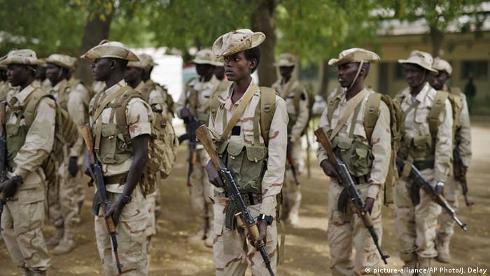 Chadian soldiers holding rifles take part in a military ceremony at an army base in the capital N'djamena