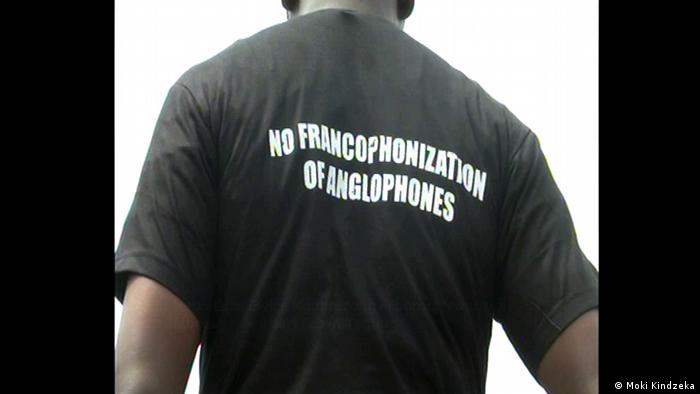 A man wearing a Tshirt saying no Francophonization of Anglophones (Moki Kindzeka)