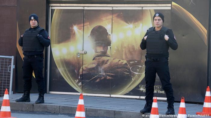Turkish police officers stand in front of the Reina nightclub