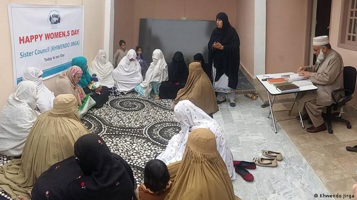 Women in burqas gather at the women's jirga in Swat Valley, Pakistan