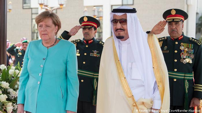 Saudi Arabia's King Salman bin Abdulaziz Al Saud stands next to German Chancellor Angela Merkel during a reception ceremony in Jeddah (Reuters/ Saudi Royal Court/Bandar Algaloud)