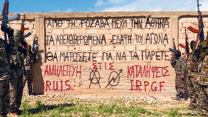 Greek anarchists in Rojava posed with a message for back home from Rojava