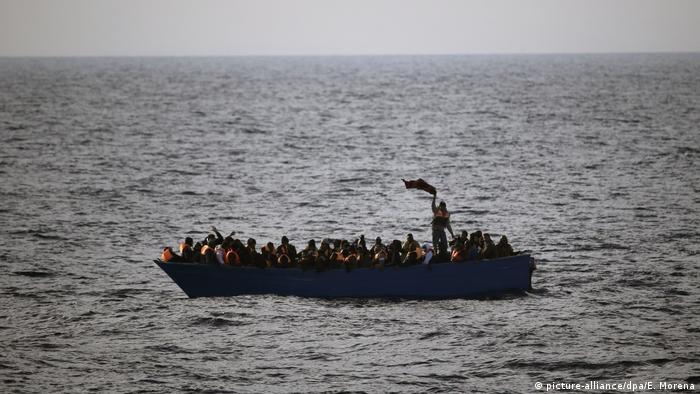 Stranded people in a boat off the coast of Libya