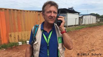 A photo of aid-worker Thomas Hoerz speaking on the phone
