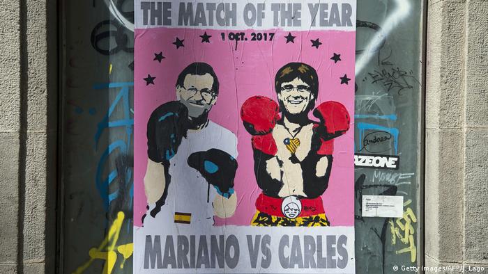 Rajoy and Puigdemont are shown wearing boxing gloves on a poster