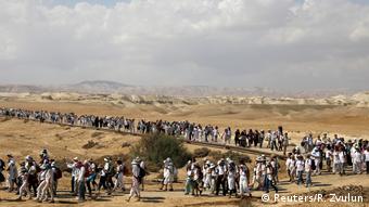 A column of women on a desert road (Reuters/R. Zvulun)