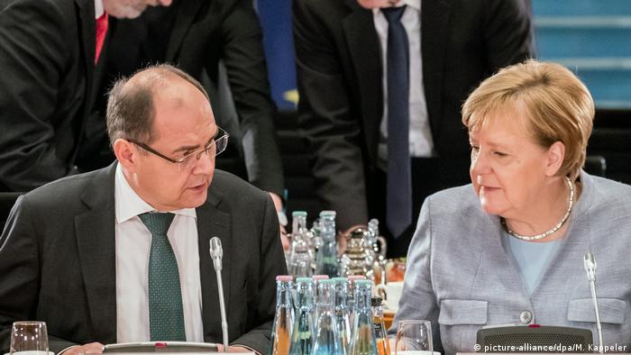 Christian Schmidt y Angela Merkel.