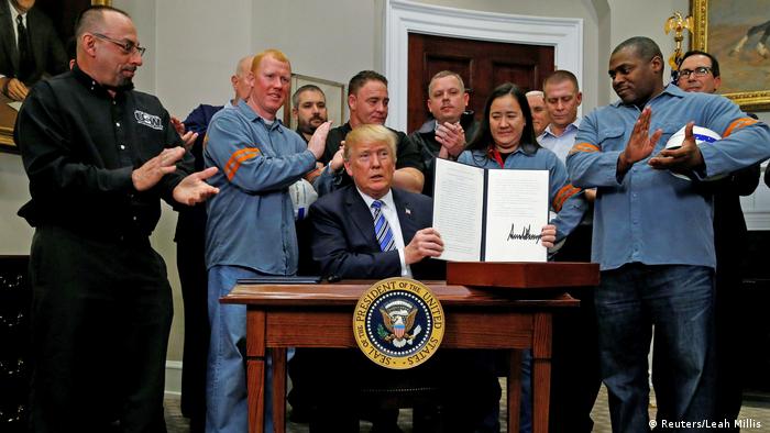   President Donald Trump in the Oval Office Surrounded by Steel Workers 