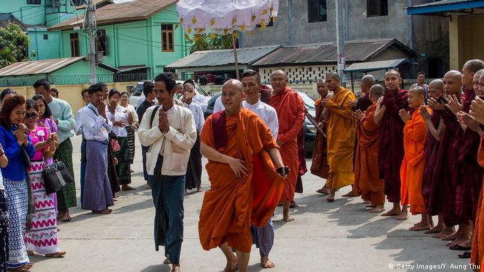 Ultra-nationalist Buddhist monk, walks among his suporters in the capital, Yangon.