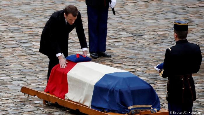 Image result for âPresident Emmanuel Macron of France, at a memorial for Col. Arnaud Beltrame, who was killed after he took the place of a hostage during a terrorist attack at a supermarket.