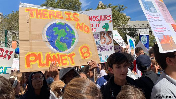 Wildlife Conservation Research - School students protest for the climate, holding a sign that reads 'There is no Planet B' 