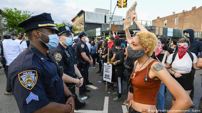 A protester faces police when Black Lives Matter protesters clash with NYPD officers