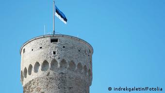 A symbolic picture of a castle in Estonia with the flag.