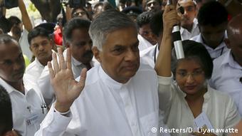 Sri Lanka's Prime Minister Ranil Wickremesinghe (C) waves as he arrives with his wife Maithree Wickramasinghe at a polling station during the general election in Colombo August 17, 2015
(Photo: REUTERS/Dinuka Liyanawatte)