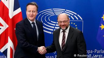 Britain's Prime Minister David Cameron poses with European Parliament President Martin Schulz (R) at the EU Parliament in Brussels.