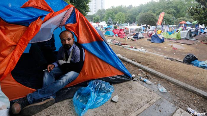 An injured protester looks out of his tent in Gezi Park on the morning of June 12