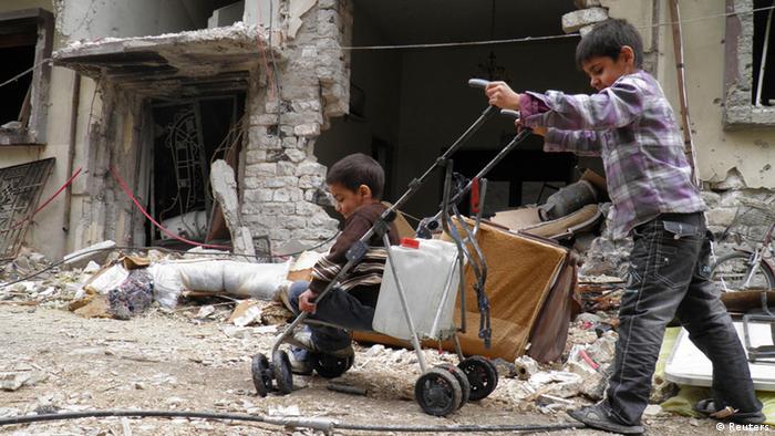 Crianças na cidade de Homs, na Síria
