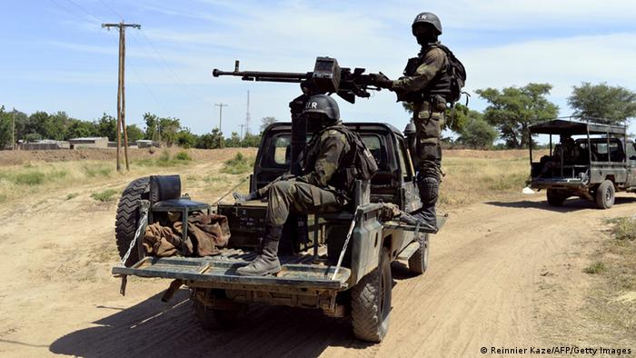 Cameroon soldiers on the back of a truck with machine gun (Reinnier Kaze/AFP/Getty Images)