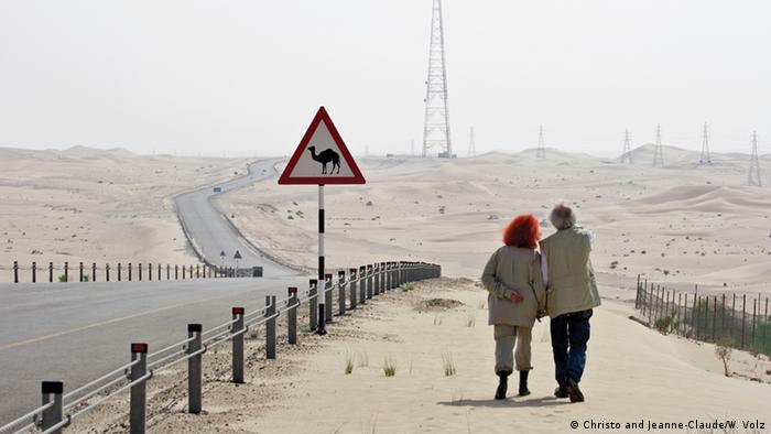 Christo and Jeannne-Claude walking along a road in the UAE (Christo and Jeanne-Claude/W. Volz)