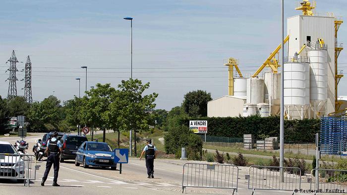 Police outside the gas factory (Reuters/E. Foudrot)