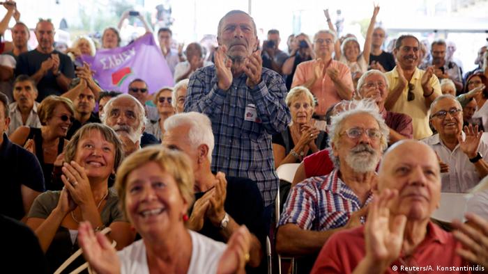 Supporters of leftist Syriza party react at the party's main election kiosk after the announcement of the first exit polls in Athens, Greece, September 20, 2015. (Reuters/A. Konstantinidis)