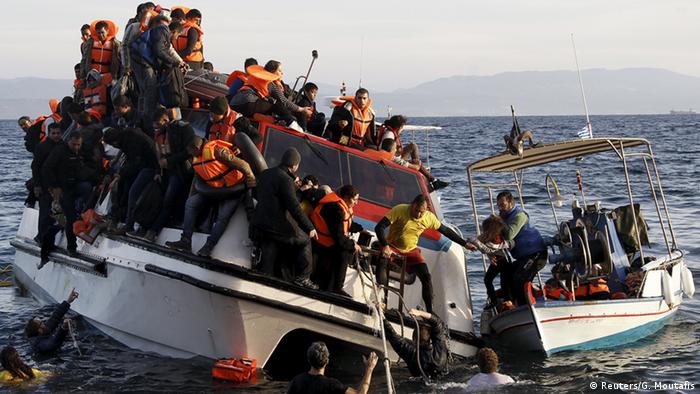 A Greek fishing boat rescues Syrian war refugees from a half-sunken catamaran off of the Greek Island of Lesbos.