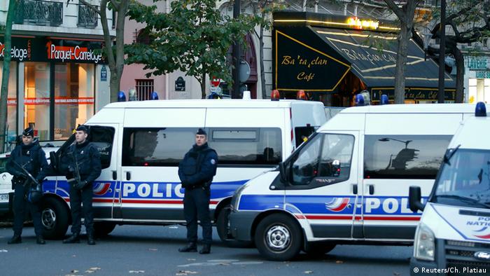 Police vehicles block the street in front of the Bataclan concert hall