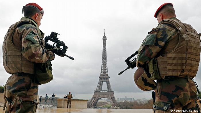 French army paratroopers patrol near the Eiffel tower