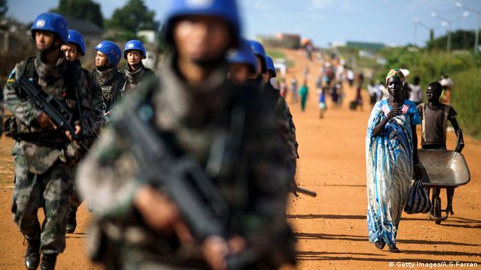 Peacekeeper troops from China deployed by the United Nations Mission in South Sudan (UNMISS), patrol on foot 