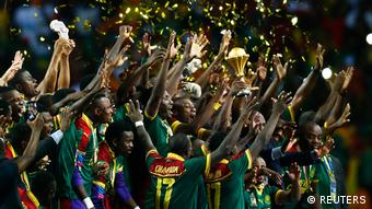 Cameroon celebrate with the trophy after winning the African Cup of Nations (REUTERS)