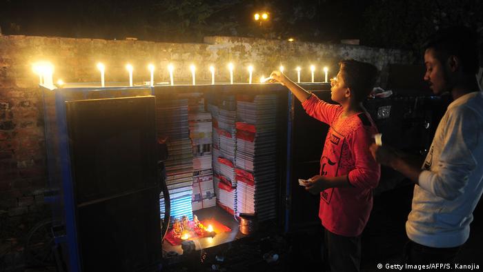 The festival begins with the lighting of candles and oil lamps, called diyas. Diwali is a contraction of the word Deepavali, which means row of lights in Sanskrit. Streets and houses are decorated with colorful lights and people typically buy gold, including jewelry, coins and small statues of the elephant-headed Ganesh ahead of the festivities.