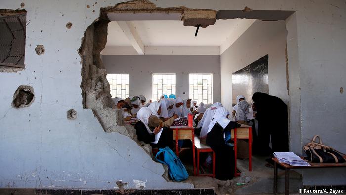 Girls attend class at their school, damaged by an airstrike in Hodeidah
