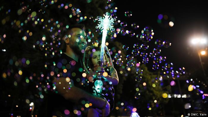 A family is seen in between soap bubbles during celebrations marking Israel's 70th Independence Day at Rabin Square in Tel Aviv, Israel