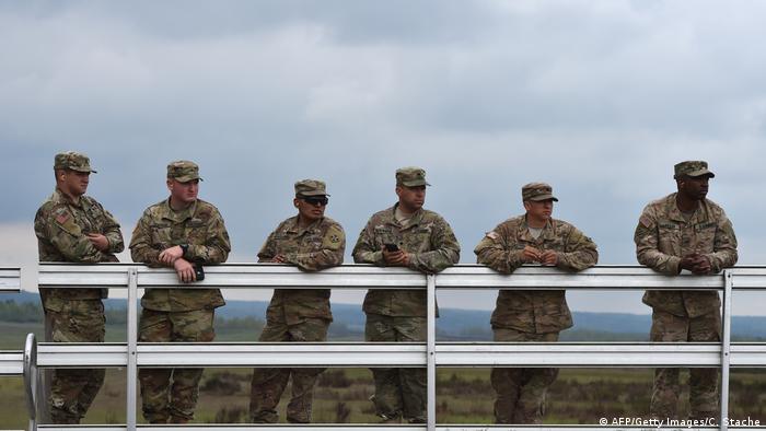 US soldiers stand at a visitor platform during the friendship shooting of the exercise 'Strong Europe Tank Challenge 2017' at the exercise area in Grafenwoehr, near Eschenbach, southern Germany, on May 12, 2017. (AFP/Getty Images/C. Stache)