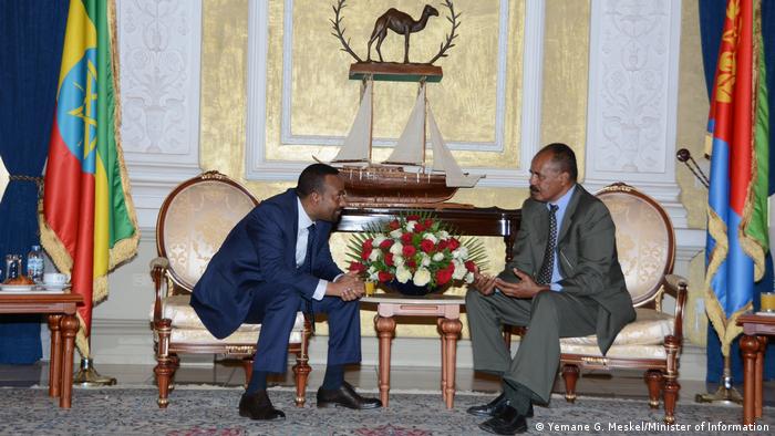 Ethiopian President Isaias Afwerki und Prime Minister Abiy Ahmed in sitting and talking in Asmara between there countries' flags. 