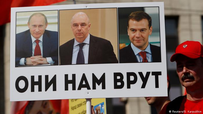 This sign
        shows Putin, Finance Minister Anton Siluanov and Prime Minister
        Dmitry Medvedev and says They lie to us in Russian (Reuters/S.
        Karpukhin)