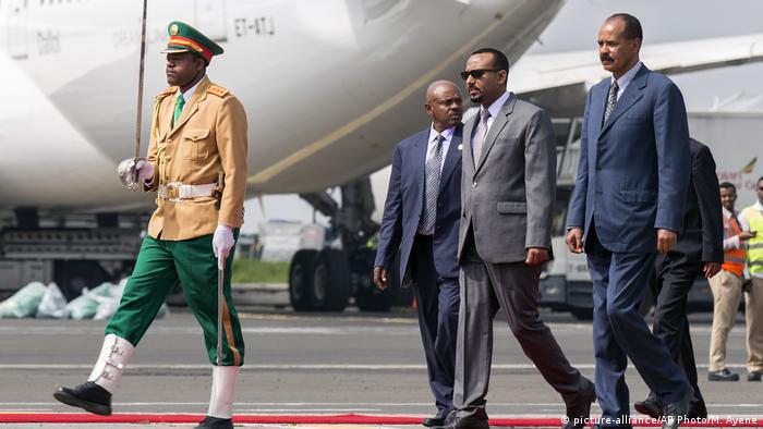 Eritrea's President Isaias Afwerki, right, is welcomed by Ethiopia's Prime Minister Abiy Ahmed, 2nd right - file photo
