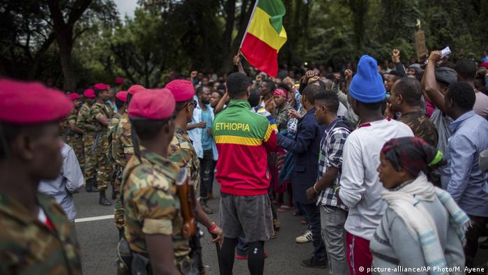 Ethiopian soldiers form a line in front of protesters