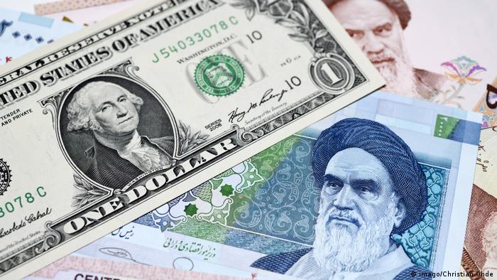 Iranischer Rial und US Dollar (imago/Christian Ohde)